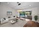 Comfortable living room with stylish furnishings and a view of the screened patio and pool area at 3089 Ashland Ter, Clearwater, FL 33761
