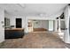 Covered patio with brick flooring, bar, ceiling fans, and sliding glass doors to the interior space at 3089 Ashland Ter, Clearwater, FL 33761