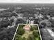 Overhead shot of the property with address identified and surrounding greenery at 309 Hidden Lake Dr, Brandon, FL 33511