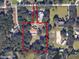 Estate aerial view showing property lines, lush greenery, and a barn with horse pastures at 309 Hidden Lake Dr, Brandon, FL 33511