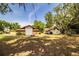Large backyard with multiple outbuildings and plenty of space for storage and recreation at 309 Hidden Lake Dr, Brandon, FL 33511