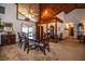 Dining room with wooden ceiling, classic furnishings, large windows, and adjacent hallway at 309 Hidden Lake Dr, Brandon, FL 33511