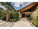 Inviting entrance featuring double doors, brick facade and lovely landscaping at 309 Hidden Lake Dr, Brandon, FL 33511