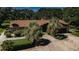 A charming single story home with lush landscaping and a large circular driveway at 309 Hidden Lake Dr, Brandon, FL 33511
