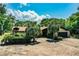 Charming single-story home with a lush yard, mature trees, and a spacious driveway at 309 Hidden Lake Dr, Brandon, FL 33511