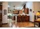 Bright kitchen features custom wood cabinets, breakfast bar with seating, and adjacent dining area at 309 Hidden Lake Dr, Brandon, FL 33511