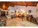 Inviting living room features a wood-paneled ceiling and ample seating, with a piano in the corner at 309 Hidden Lake Dr, Brandon, FL 33511