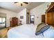 Inviting main bedroom with a view of the pool area offering a peaceful retreat with easy access to the outdoor amenities at 309 Hidden Lake Dr, Brandon, FL 33511