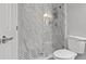 Elegant bathroom with a glass-enclosed shower and a mosaic-patterned shower floor at 3138 Deergrass Ct, Holiday, FL 34691