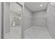 View into a large bathroom with a glass shower enclosure and spacious walk-in closet at 3138 Deergrass Ct, Holiday, FL 34691