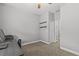 Bedroom features a computer desk and a closet in a minimalist interior at 3138 Deergrass Ct, Holiday, FL 34691