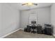 Bedroom features a computer desk and a window with blinds at 3138 Deergrass Ct, Holiday, FL 34691