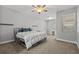 Bright bedroom with a comfortable bed, natural light, and neutral color palette at 3138 Deergrass Ct, Holiday, FL 34691