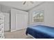 A cozy bedroom features a twin bed, closet, and natural light, with neutral paint at 3138 Deergrass Ct, Holiday, FL 34691