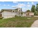 Side view of home with manicured lawn and clean landscaping surrounding the house at 3138 Deergrass Ct, Holiday, FL 34691