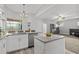 Open kitchen featuring a granite island, modern cabinets, and recessed lighting at 3138 Deergrass Ct, Holiday, FL 34691