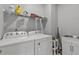 Functional laundry room featuring a Whirlpool washer, dryer and utility sink at 3138 Deergrass Ct, Holiday, FL 34691