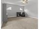 Comfortable living room featuring a fireplace, accent chair, and neutral tones at 3138 Deergrass Ct, Holiday, FL 34691