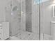 Luxurious walk-in shower with marble and tile accents, modern fixtures, and glass enclosure at 3138 Deergrass Ct, Holiday, FL 34691