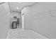 Spacious walk-in closet with ample shelving, hanging space, and clean design at 3138 Deergrass Ct, Holiday, FL 34691