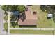 Aerial view of a home showcasing a well-maintained roof, spacious yard, and convenient street access at 3201 E Mcberry St, Tampa, FL 33610