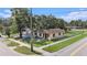 Charming single-story home with a well-manicured lawn, mature trees, and convenient street access at 3201 E Mcberry St, Tampa, FL 33610