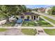 Charming home with a covered carport, lush green lawn, and convenient street access at 3201 E Mcberry St, Tampa, FL 33610