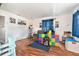 Spacious living room with wood-look floors, large window, and cozy seating at 3201 E Mcberry St, Tampa, FL 33610