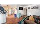 Cozy living room with wood-look floors, an entertainment center, and an open layout at 3201 E Mcberry St, Tampa, FL 33610