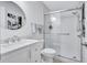 Bathroom featuring updated sink and glass enclosed shower at 3271 Mcmath Dr, Palm Harbor, FL 34684