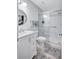 Bathroom featuring updated vanity and glass enclosed shower at 3271 Mcmath Dr, Palm Harbor, FL 34684