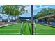 Outdoor bocce ball courts with surrounding benches and seating areas at 3271 Mcmath Dr, Palm Harbor, FL 34684