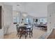 Open-concept dining area seamlessly connects to the living room, offering an inviting space for gatherings at 3271 Mcmath Dr, Palm Harbor, FL 34684