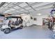 Spacious garage with golf cart, storage, and a sink, offering convenience and functionality at 3271 Mcmath Dr, Palm Harbor, FL 34684