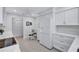 Well-lit kitchen with white cabinets, modern appliances, and a breakfast area, providing a stylish and efficient space at 3271 Mcmath Dr, Palm Harbor, FL 34684