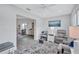 Bright living room with a cozy seating area, plush rug, and calming decor, creating a relaxing atmosphere at 3271 Mcmath Dr, Palm Harbor, FL 34684