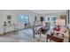 Bright living room featuring neutral decor, wood floors, and a comfortable seating area at 3271 Mcmath Dr, Palm Harbor, FL 34684