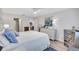 Spacious bedroom boasts neutral paint, wood-look floors, and bright natural light at 3271 Mcmath Dr, Palm Harbor, FL 34684