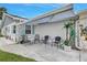 Inviting covered front patio, ideal for outdoor relaxation with neutral decor and ample seating at 3271 Mcmath Dr, Palm Harbor, FL 34684