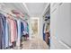 Walk-in closet provides ample storage, with racks, shelves, and access to the bathroom at 3271 Mcmath Dr, Palm Harbor, FL 34684