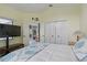 Bedroom view with a large closet, access to other rooms, and a yellow paint color at 3457 Foxhall Dr, Holiday, FL 34691