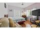 Comfortable bedroom with natural light, closet, and seating area at 3457 Foxhall Dr, Holiday, FL 34691