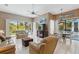 Open concept living room with plenty of natural light and access to the patio at 3457 Foxhall Dr, Holiday, FL 34691