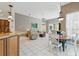 Bright living space with tile floors, open floorplan, and view of the outdoor patio at 3457 Foxhall Dr, Holiday, FL 34691