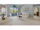 Inviting living room offering neutral tones, a view of the pool, and comfortable seating arrangements at 3457 Foxhall Dr, Holiday, FL 34691