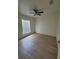 Bedroom featuring ample natural light and wood-look floors at 3713 N 31St St, Tampa, FL 33610