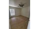 Bright bedroom with wood-look flooring and a window at 3713 N 31St St, Tampa, FL 33610