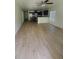 Open-concept living space with wood-look flooring at 3713 N 31St St, Tampa, FL 33610