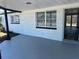Spacious front porch features fresh paint, creating an inviting outdoor living space at 3844 Cedarwood Dr, Holiday, FL 34691