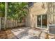 Outdoor patio space with a privacy fence and easy access to the home's sliding glass doors at 409 S Audubon Ave # 3, Tampa, FL 33609